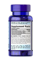 Puritan's Pride Flush Free Niacin 500 mg supplement facts on blue bottle, supporting heart health and energy metabolism.